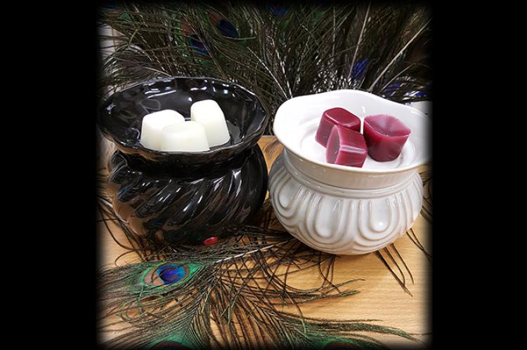 small black and cream coloured ceramic warmers